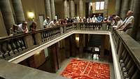 Visitors in the entry hall at the Federal Ministry of Defence in Berlin